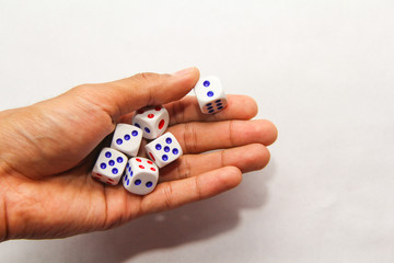 Hand throw the dice on white background