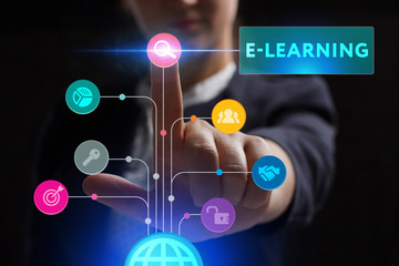 The concept of business, technology, the Internet and the network. A young entrepreneur working on a virtual screen of the future and sees the inscription: E-learning