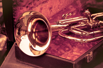Old trumpet exposed in an italian flea market - toned image