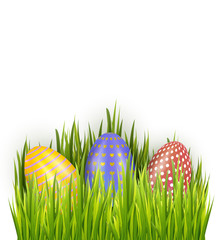 Colorful decorated Easter eggs in fresh green grass isolated on white background. Horizontal holiday banner decorations.