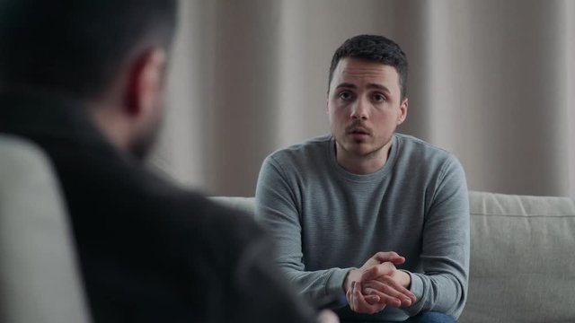 Young man on reception at the psychotherapist
