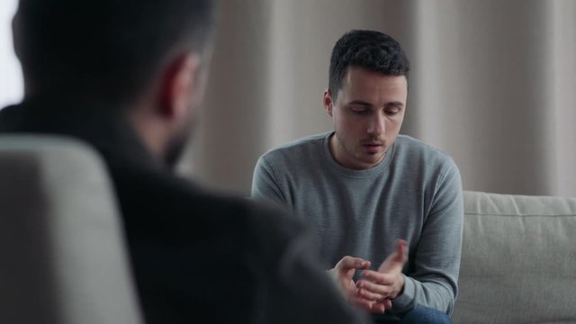 A young man tells a psychologist that he cares