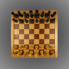 White and black chess pieces  placed on a chessboard