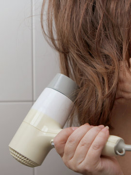 Woman blow-dry hair