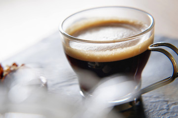 Close up of freshly brewed coffee in glass cup