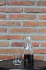 glass of coffee on wooden table