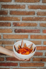 red chili peppers on wooden plate