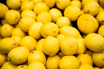 fresh citrus fruits are on the counter in the store