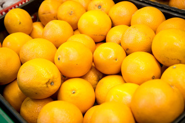 fresh citrus fruits are on the counter in the store