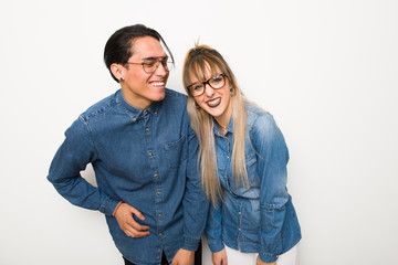 Young couple with glasses happy and smiling