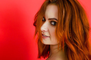 Sexy nude woman on red background. Close-up portrait. Cosmetology. Care. Women's health. Sexuality.