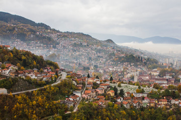 Fototapeta premium View from the high point to Sarajevo in the mist in the morning. Bosnia and Herzegovina