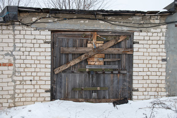 the garage is an indoor, boarded a cross