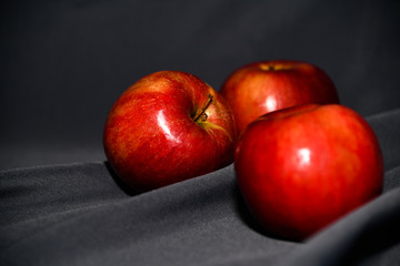 red apples on dark background