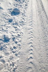 track on the snow from the tread of the car on the winter road