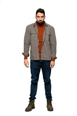 Naklejka premium Full-length shot of Handsome man with beard with sad and depressed expression on isolated white background