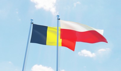Poland and Belgium, two flags waving against blue sky. 3d image