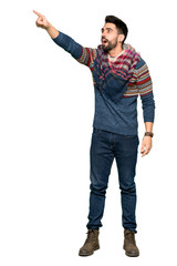 Full-length shot of Hippie man pointing away on isolated white background