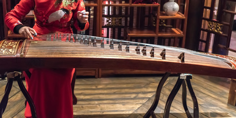 Women are playing zither, Chinese instruments