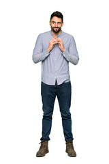 Full-length shot of Elegant man with shirt scheming something on isolated white background
