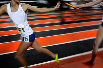 Relay Race Running as Team Towards Victory and Success with Baton