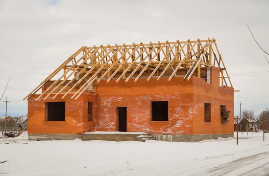 Building Site With House Under Construction