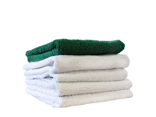 Stack of colorful bath towels  on white background.Pile of rainbow colored towels isolated.Top view.Hygiene, fabric,spa and textile concept.