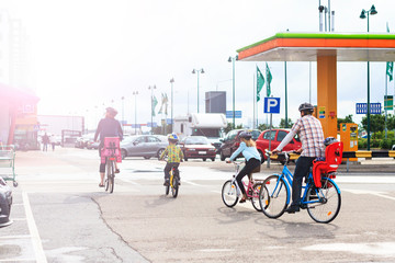 family on bikes going to the market with sunny hotspot