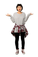 A full-length shot of a Young woman with short hair in zen pose over isolated white background
