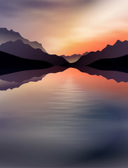 a sunset in the mountains with a lake in the front