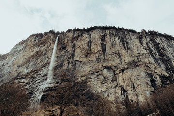 Fototapeta na wymiar Waterfall in Lauterbrunnen, Switzerland. Winter landscape, cold.