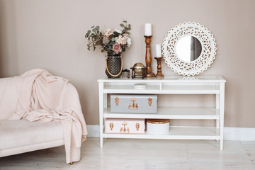 Stylish spring decor in the living room. Bright beautiful room in powder and pink tones.