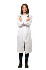 A full-length shot of a Young doctor woman pointing to the laterals having doubts over isolated white background