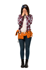 A full-length shot of a Young worker woman with tired and sick expression over isolated white background