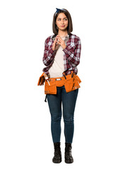 A full-length shot of a Young worker woman scheming something over isolated white background