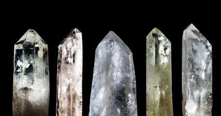 Group of rock crystals or pure quartz isolated on black background. 