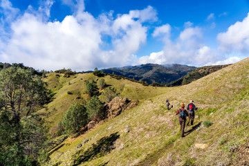 Fototapeta na wymiar Hikers Hiking along Mountain Trail