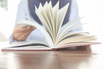 Women Muslim students studying and reading with books in  library, concept: Development of learning and education, workplace for knowledge outside the classroom, female young open textbook school 