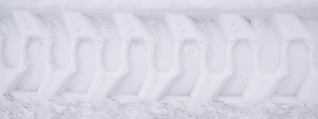 Close-up snowplow track in snow