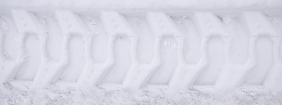 Close-up Snowplow Track In Snow