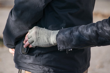 Thief steals wallet from pocket