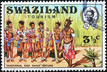Costumes for traditional dance in Swaziland on stamp