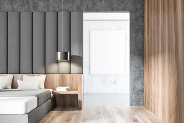 Gray and wooden bedroom with poster