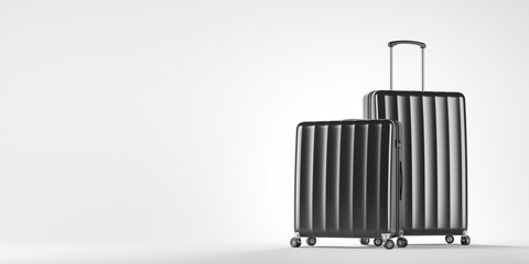 Two black suitcases on white