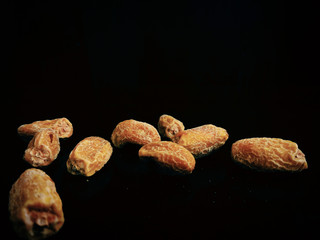 dried raw dates with black background