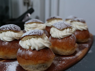 Traditional Swedish Semla served on rustic cutting board