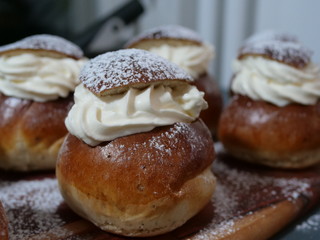 Traditional Swedish Semla served on rustic cutting board