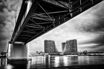A panorama of Belgrade seen from the banks of the Sava River. Old bridge and waterfront of Belgrade. Black white photo
