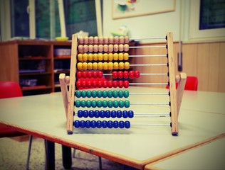 wooden abacus in the classroom to learn decimal numeral system w