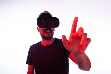 Cheerful man touching screen in virtual reality
